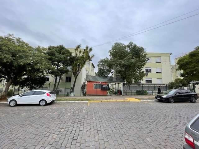 Ótimo apto térreo 3 dormitórios com living 2 ambientes em L, banheiro social, cozinha e área de serviço. &lt;BR&gt;&lt;BR&gt;Prédio com portaria 24 H, playground, estacionamento rotativo, churrasqueir