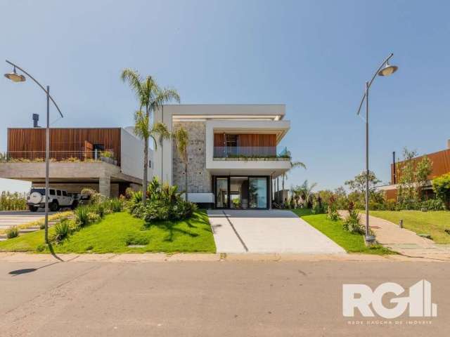 Luxuosíssima residência às margens do Guaíba, no Ponta da Figueira Marina, que é o primeiro e único condomínio residencial horizontal  com canais navegáveis do Brasil. Localizado em Eldorado do Sul, h