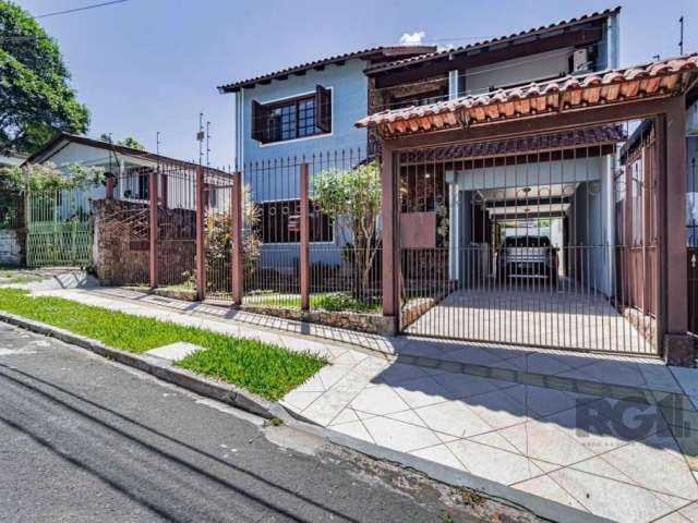 Casa à venda em Gravataí, localizada no bairro Vera Cruz, com 3 dormitórios, sendo 1 suíte e 4 banheiros. Com 190m² de área privativa e 4 vagas de garagem. Infraestrutura completa com armários embutid