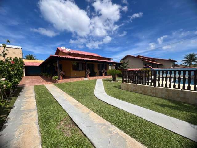 Casa linear com piscina e área gourmet em Barra Nova.