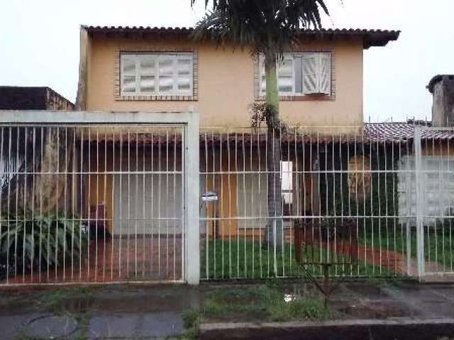 Casa com 4 quartos à venda na Rua Urussanga, Guarujá, Porto Alegre, 275 m2 por R$ 500.000