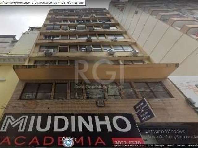 Aluga sala região central com 27,35m², banheiro, portaria 24 horas e câmeras de segurança.