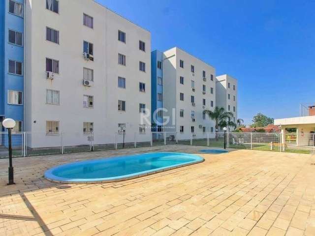 Apartamento no bairro Restinga, condomínio Vivendas do Sol II, com dois dormitórios, amplo living com uma bancada de marmore e 3 cadeiras, cozinha com moveis sob medida, banheiro social com box de vid