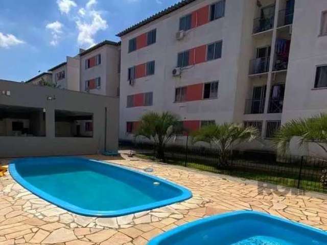 Apartamento de 2 dormitórios, sala, cozinha, área de serviço, banheiro e sacada com porta de vidro e tela de proteção, no banheiro box de vidro. Garagem fixa.&lt;BR&gt;Condomínio com piscina, salão de