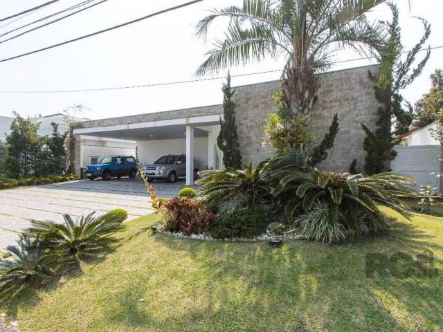 Casa Magnifica, residência em condomínio de altíssimo padrão, com 4 suítes sendo uma suíte master, living 3 ambientes, hall, lavabo, ampla cozinha, área de serviço com banheiro auxiliar. Condomínio co