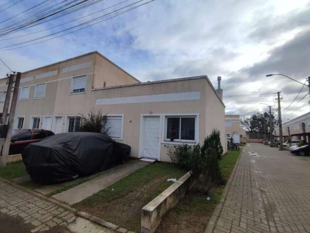 Linda casa térrea em Condomínio fechado no bairro Restinga, com  2 dormitórios, amplo living, cozinha, banheiro social, lavanderia, espaço gourmet com churrasqueira. Condomínio com ótima infra, salão 