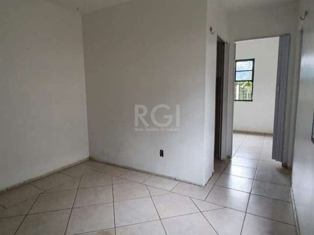 Apartamento térreo  tipo casa de 46m², 2 dormitórios, vaga de garagem junto ao apartamento com entrada fechada e porta com sáida direto para o pátio do condomínio, em condomínio próximo ao Posto Tinga