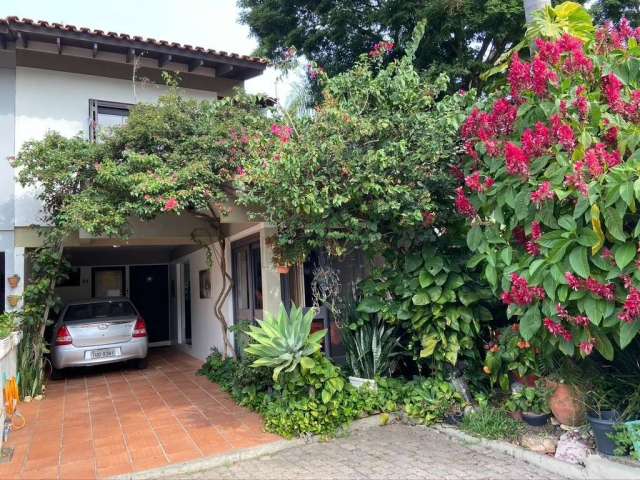 Casa em condomínio fechado com 3 quartos à venda na Rua Almirante Mariath, 69, Tristeza, Porto Alegre por R$ 980.000