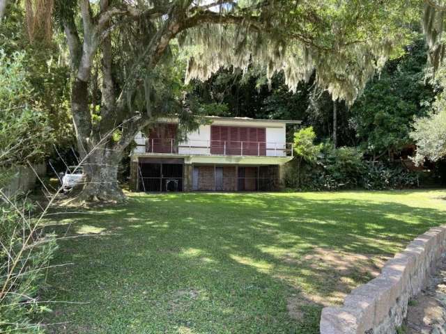 Casa com 3 quartos à venda na Rua Jacarandás, 136, Ponta Grossa, Porto Alegre por R$ 700.000