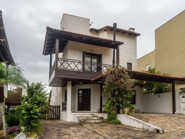 Casa em condomínio fechado com 3 quartos à venda na Avenida Edgar Pires de Castro, 540, Hípica, Porto Alegre por R$ 640.000