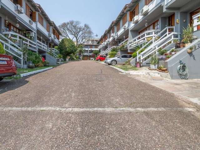 Casa em condomínio fechado com 3 quartos à venda na Rua General Rondon, 1259, Tristeza, Porto Alegre por R$ 890.000