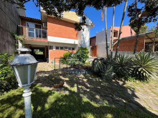 Casa com 3 quartos à venda na Rua Jacundá, 164, Guarujá, Porto Alegre por R$ 750.000