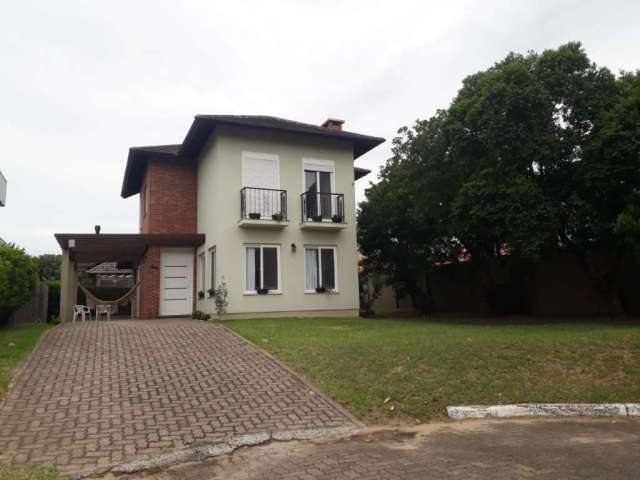 Casa em condomínio fechado com 3 quartos à venda na Da Lagoa, 1111, Farroupilha, Osório, 170 m2 por R$ 1.300.000