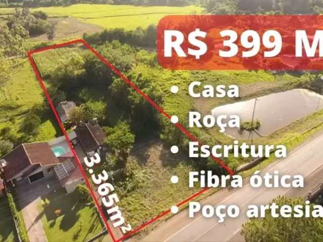 Chácara com casa, horta, pomar, fibra ótica e poço de frente para o asfalto em rolante