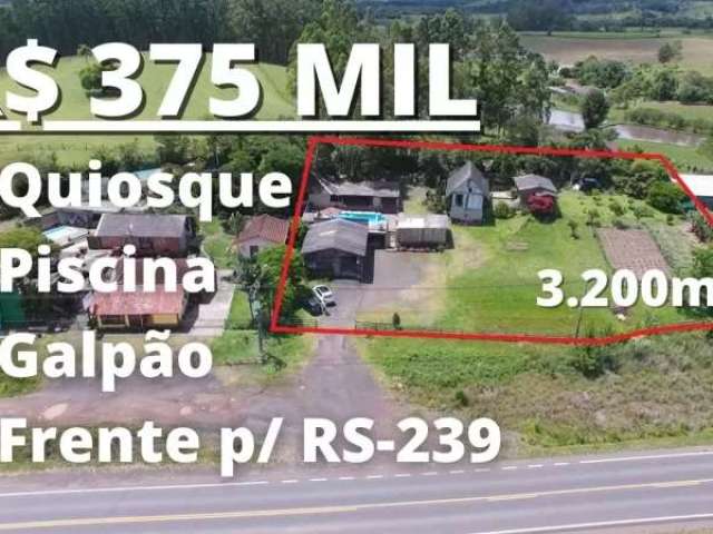 Chácara com casa, quiosque, piscina, cabana e galpão de frente para rs-239 em taquara