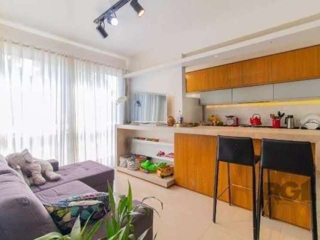 Vende-se apartamento mobiliado,  2 quartos/ sendo 1 dormitório com suíte,  orientação solar Norte,  vaga de garagem coberta e escriturada, no Bairro Jardim Botânico,  living em dois ambientes com cozi