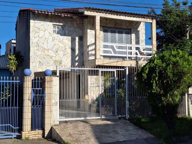 Sobrado com 3 dormitórios, suíte, churrasqueira, lareira, no Jardim Algarve em Alvorada - RS.&lt;BR&gt;&lt;BR&gt;Excelente sobrado , no primeiro pavimento conta com a sala de estar/jantar , 1 dormitór