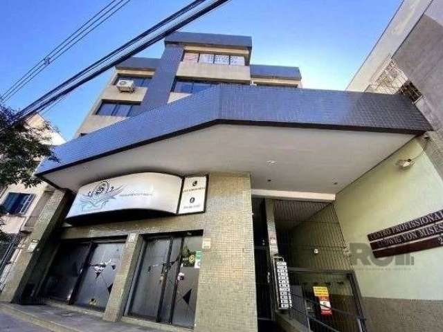 Excelente sala comercial, com 38 m² privativos, com banheiro e uma vaga de garagem. Ótima iluminação. Prédio com hall de entrada, elevador, salão de festas com churrasqueira e terraço, interfone e cir