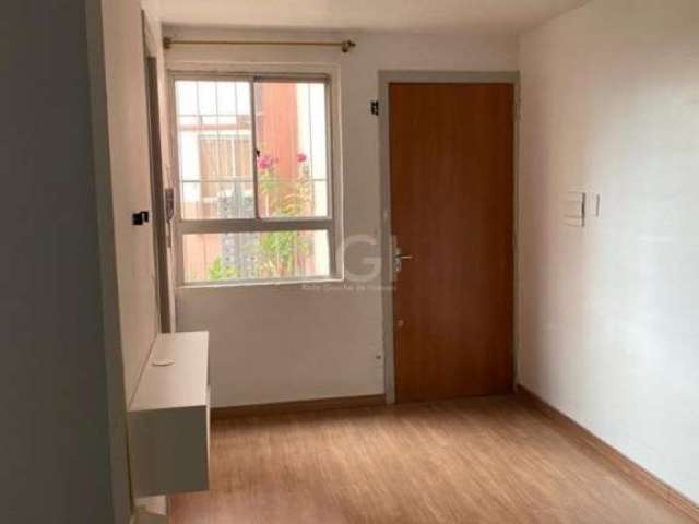 Vende-se apartamento térreo desocupado, semi mobiliado, 2 dormitórios, living amplo em 2 ambientes, copa e cozinha, área de serviço e 1 vaga de garagem. Prédio com salão de festas, zeladoria, churrasq