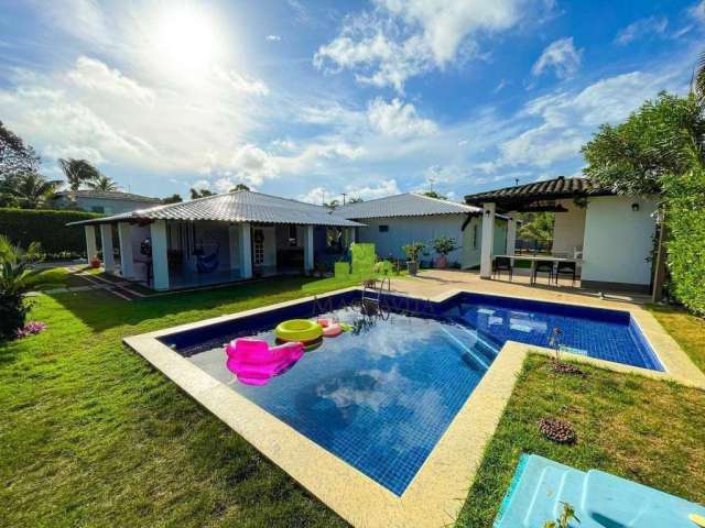 Casa térrea à venda em Lauro de Freitas: 374m², 6 quartos, 4 suítes, piscina, espaço gourmet, condomínio com lazer e segurança 24h na Estrada Coco