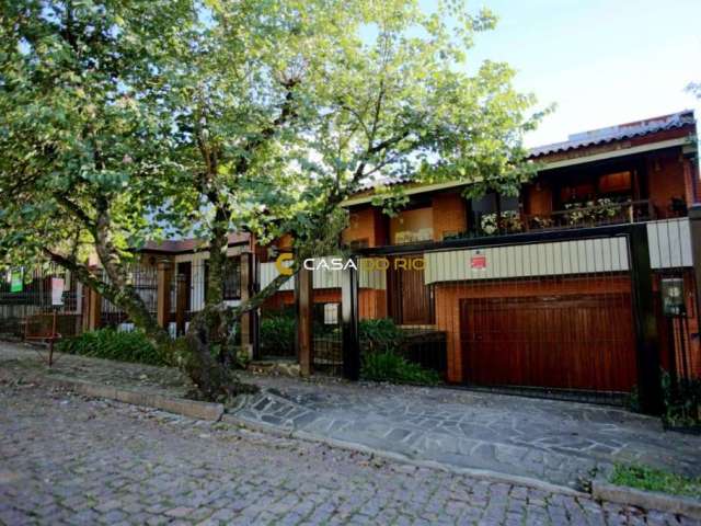 Casa com 4 quartos à venda na Rua Alcebíades Antônio dos Santos, 157, Nonoai, Porto Alegre por R$ 1.650.000