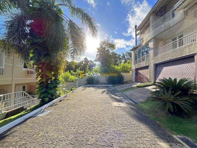 Casa em condomínio fechado com 3 quartos à venda na Avenida Coronel Marcos, 39, Pedra Redonda, Porto Alegre por R$ 1.200.000