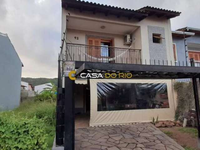 Casa com 3 quartos à venda na Rua Attilio Bettio, 92, Aberta dos Morros, Porto Alegre por R$ 580.000