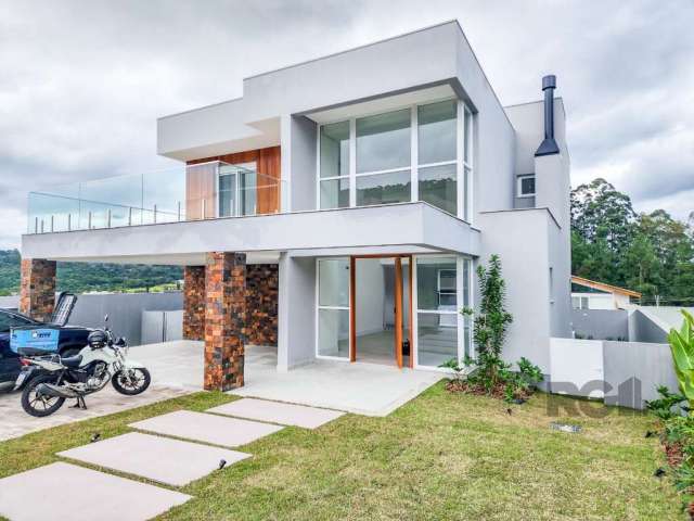 Excelente residência , no Lombardia, fachada Sul&lt;BR&gt;São  4 suítes, 1 suite na parte inferior podendo ser tranquilamente opção para 1 escritório. Living amplo, espaço gourmet integrado com cozinh