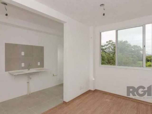 Apartamento 2 dormitórios,  living 2 ambientes, área serviço separada, cozinha americana com churrasqueira, laminado pronto para morar, prédio semi novo, com portaria, salão festas, quadra de esportes