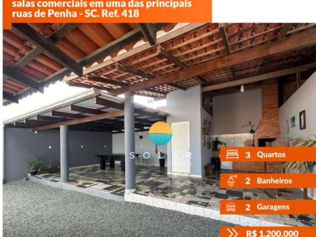 Excelente sobrado com 3 dormitórios e 02 salas comerciais em uma das principais ruas de Penha - SC. Ref. 418