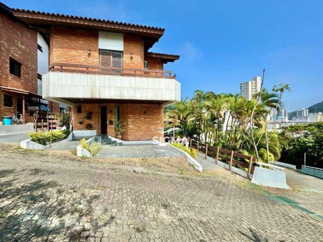 Casa com 4 quartos sendo 2 suítes à venda na Praia da Enseada - Guarujá/SP.