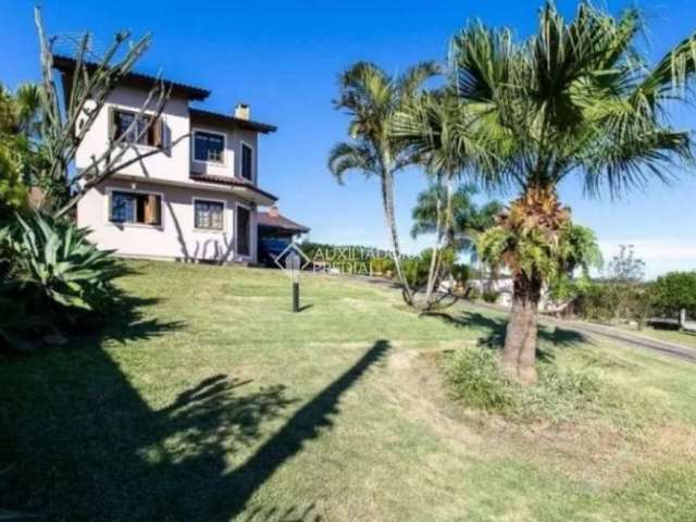 Casa em condomínio fechado com 3 quartos para alugar na Rua Flor de Pessegueiro, 105, Vila Nova, Porto Alegre, 249 m2 por R$ 7.000