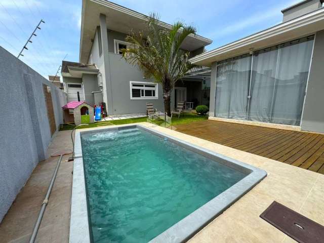 Casa com 3 dormitórios, sendo 3 suítes, 4 vagas, no Bairro Marechal Rondon em Canoas - RS.