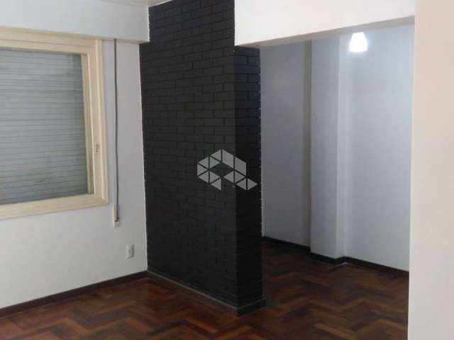 Apartamento de um dormitório semi mobiliado  no centro