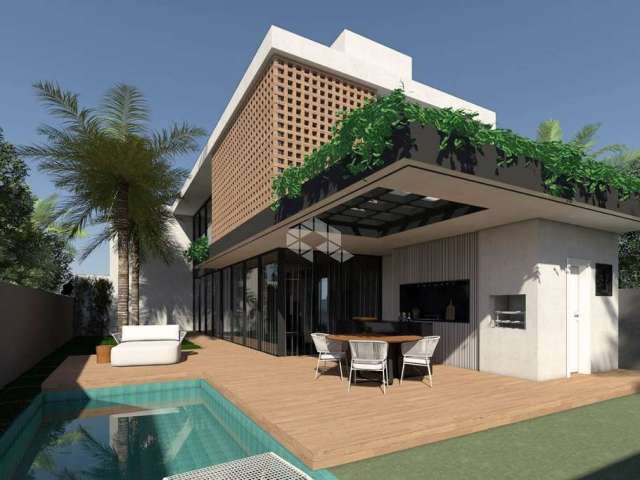 CASA RESIDENCIAL NO BAIRRO VIVAPARK, EM PORTO BELO, SC, COM 255m² PRIVATIVOS, PISCINA, ESPAÇO GOURMET, 04 SUÍTES, E 02 VAGAS DE GARAGEM COBERTAS.