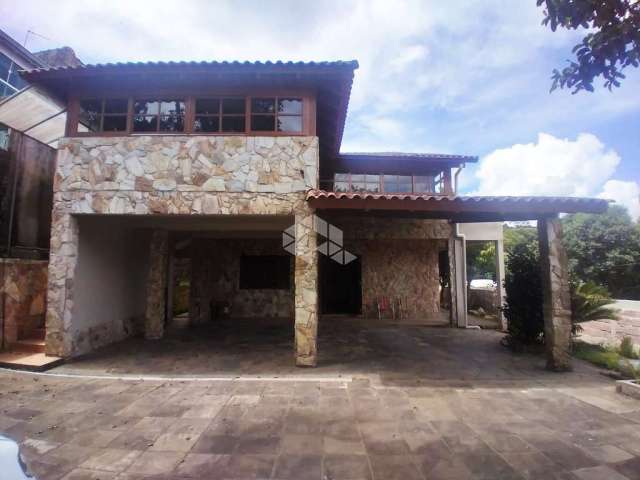 Casa/sobrado à venda, 510m², 5 dormitórios sendo 3 suítes, 5 vagas, bairro Vila Nova, Porto Alegre/RS