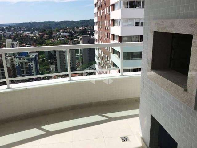 Apartamento com três dormitórios (um suíte), sacada com churrasqueira, duas vagas