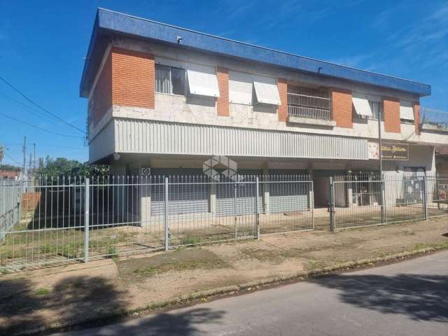 Excelente Prédio com Amplo Apartamento com 3 dormitórios, suíte no segundo andar com garagem e 3 lojas grandes no térreo em avenida no bairro Sarandi