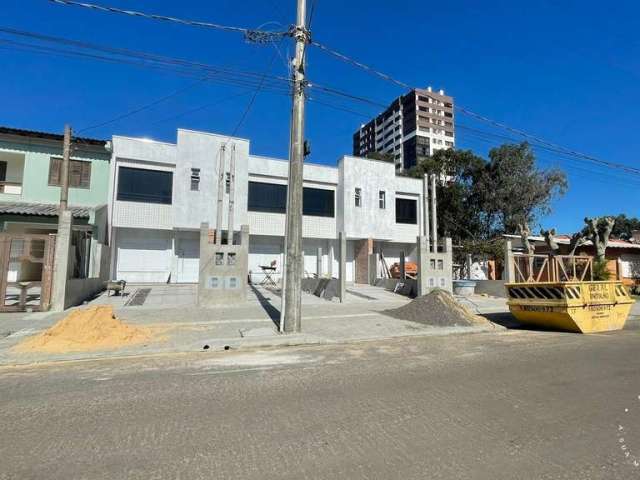 Duplex duas suítes novo no centro de Tramandaí