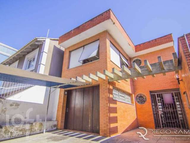 Casa com 4 quartos à venda na Rua Eudoro Berlink, 482, Auxiliadora, Porto Alegre por R$ 1.799.000