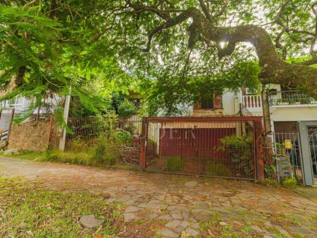 Casa com 4 quartos à venda na Avenida General Barreto Viana, 537, Chácara das Pedras, Porto Alegre por R$ 950.000