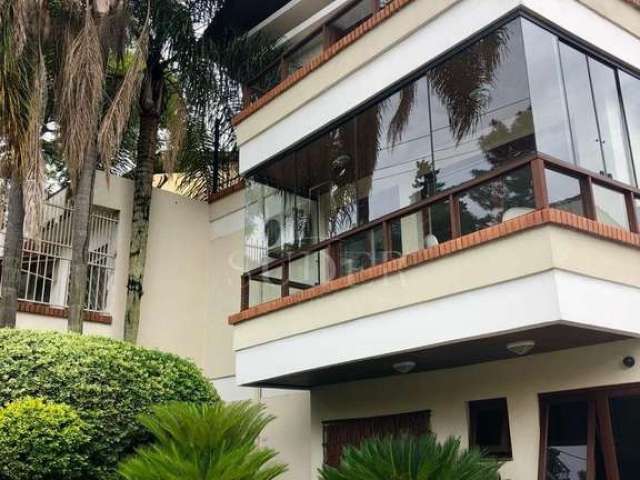 Casa em condomínio fechado com 3 quartos à venda na Rua Silveiro, 1007, Menino Deus, Porto Alegre por R$ 1.100.000