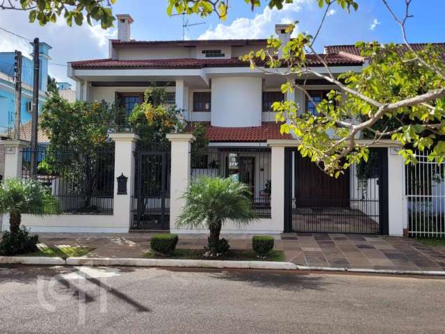 Casa com 6 quartos à venda na Rua Irmão Agnelo Chaves, 170, Marechal Rondon, Canoas por R$ 1.730.000