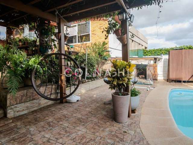 Casa em condomínio fechado com 3 quartos à venda na Rua Professor Ulisses Cabral, 189, Chácara das Pedras, Porto Alegre por R$ 1.100.000