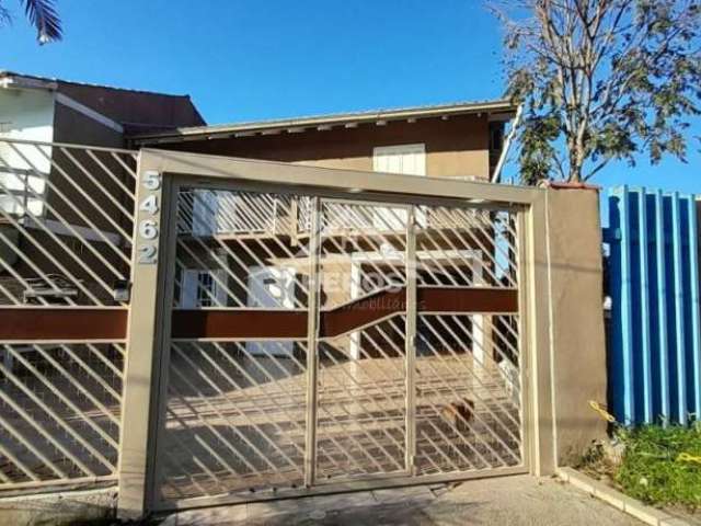 Casa em condomínio fechado com 3 quartos à venda na Avenida Edgar Pires de Castro, 5806, Restinga, Porto Alegre por R$ 700.000