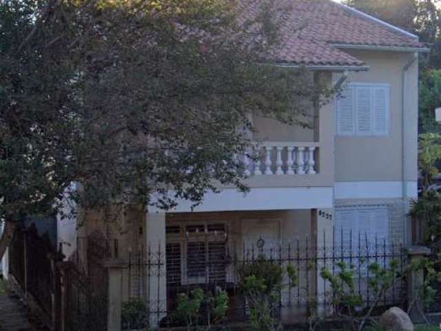 Casa com 3 quartos à venda na Avenida da Cavalhada, 6227, Cavalhada, Porto Alegre por R$ 577.000