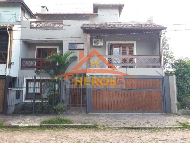 Casa com 3 quartos à venda na Rua Engenheiro Tito Marques Fernandes, 40, Ipanema, Porto Alegre por R$ 985.000