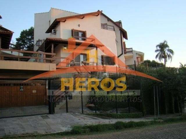 Casa com 4 quartos à venda na Rua Arachanes, 183, Espírito Santo, Porto Alegre por R$ 1.100.000