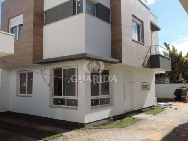 Casa em condomínio fechado com 3 quartos à venda na Rua Paraguá, 54, Vila Assunção, Porto Alegre por R$ 1.200.000