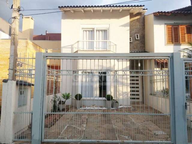 Casa com 3 quartos à venda na Rua Wilson Conceição Bona, 104, Hípica, Porto Alegre por R$ 580.000